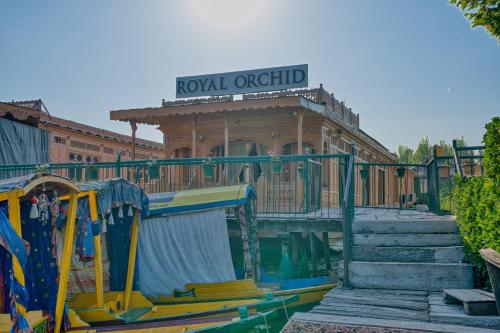 a building next to a water park with a playground at Best View Group Of Houseboats in Srinagar