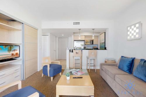 a living room with a couch and a table at 1BR Apartment with Ocean View in Sunny Isles Beach