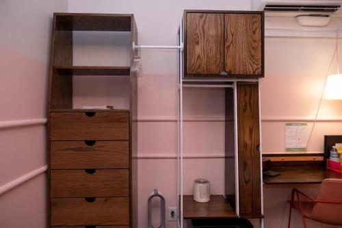 a room with two wooden bunk beds and a desk at The Russell in Nashville