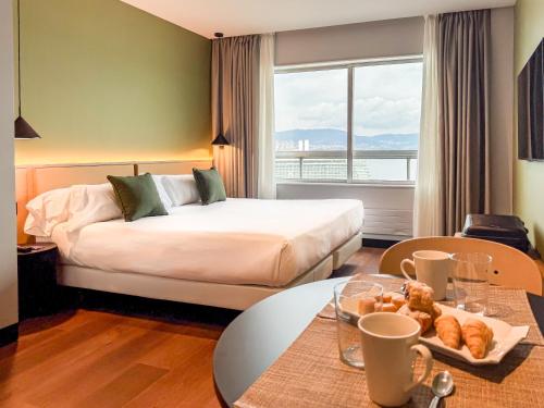 Кровать или кровати в номере Hotel Bahía de Vigo