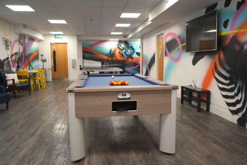 a room with a pool table in a office at Hydrogen in Nottingham in Nottingham