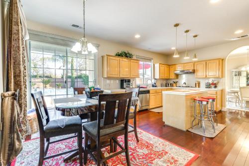 a kitchen with a table and chairs and a dining room at Outdoor Oasis and Hot Tub! Spacious Clovis Home in Clovis