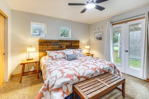 a bedroom with a bed and a ceiling fan at Rockaway Beach Home with Hot Tub 4 Blocks to Beach! in Rockaway Beach