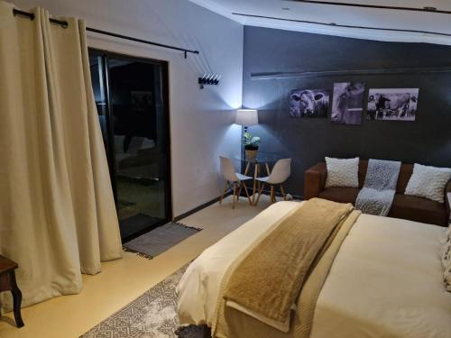 Ένα ή περισσότερα κρεβάτια σε δωμάτιο στο Toekoms Inn