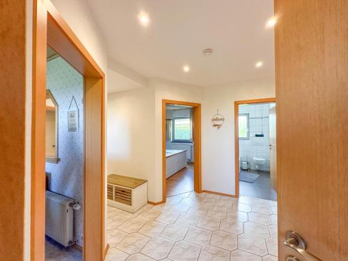 a bathroom with a shower and a toilet at Landhaus Landgelück in Hellenthal
