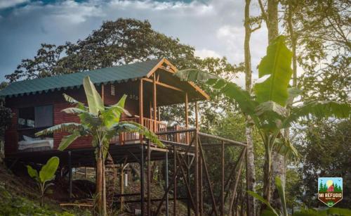 a tree house in the middle of a forest at Glamping la Joyita in Chimbe