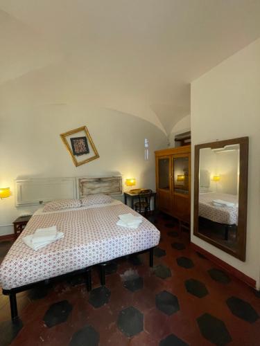 Een bed of bedden in een kamer bij il Plancton