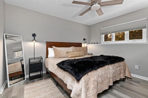 a bedroom with a bed and a ceiling fan at Laurelwood 44 with Wintergreen Advantage in Wintergreen