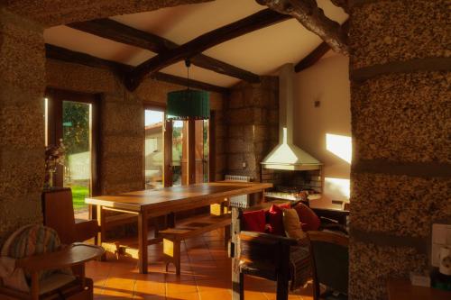 a dining room with a wooden table and chairs at Cozy Family Home in Amazing Mountain with piano in Candemil