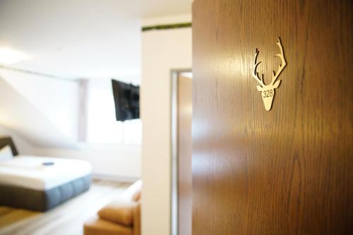 a door with a deer head on it in a room at Smart Resorts B&B 2 BB2 328 in Winterberg
