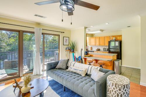 a living room with a couch and a table at Hot Springs Condo on Lake Hamilton with Views! in Hot Springs