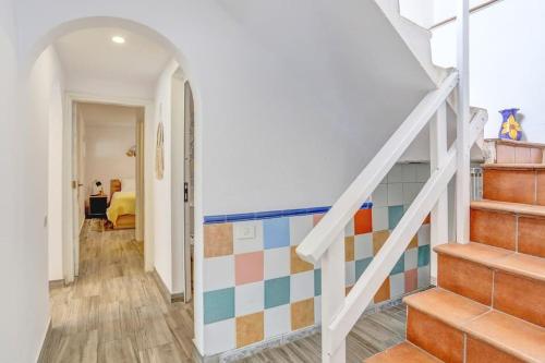 a room with a staircase with colorful tiles at Casa Vistamar comfy 4bd few steps to the ocean in Las Playas