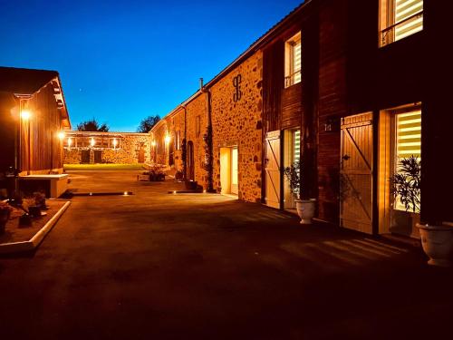 an empty courtyard of a building at night at 3-Star Tourism Rated Holiday 1 Bedroom Home with Aircon and Private Pool - 40 Mins from Bergerac in Capdrot