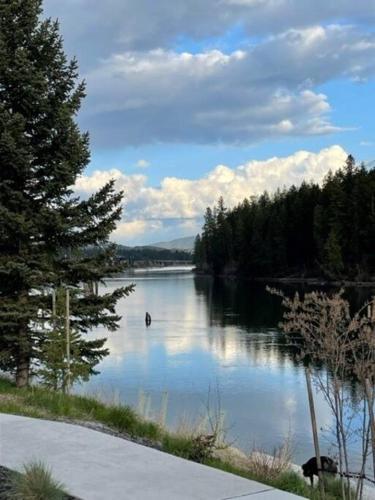 a view of a lake with a boat in it at Coeur d Alene Riverstone Retreat in Coeur d'Alene