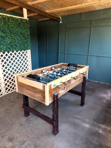 a wooden foosball table sitting in a room at Estancia Don Domingo in Hualañé
