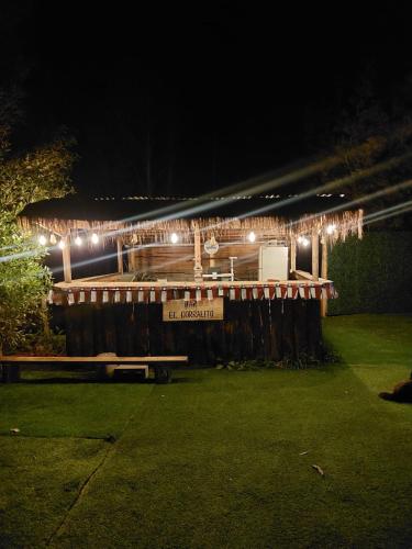 a building with lights on it at night at Estancia Don Domingo in Hualañé