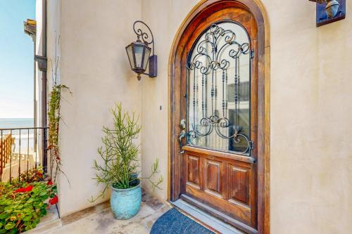 an entry door to a house with a plant at Breakers Way Adventure in Carpinteria
