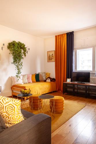 a living room with a couch and a table at Vânători Nest - 2 room - Pumo properties in Bucharest