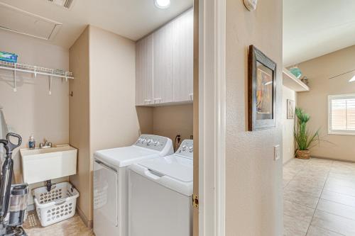 a laundry room with a washer and dryer at Heated Pool at 3 BR Home 5 Mi to Coachella! in La Quinta