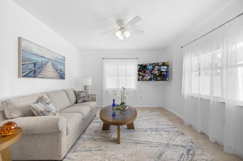 a living room with a couch and a table at Sunset Inn - Hallandale Beach in Hallandale Beach