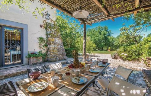 a table and chairs on a patio at Villa Lavinia in Vitorchiano