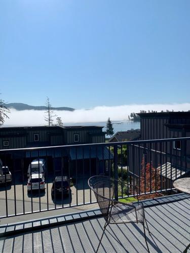 a basketball hoop on a balcony with a parking lot at Sooke Harbour Townhouse in Sooke