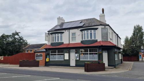 a building with solar panels on top of it at The Ivy Tree in Stockton-on-Tees