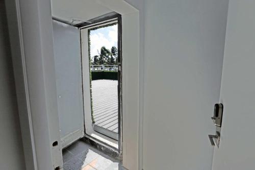 a door with a window in a room at Rooftop Retreat on Ocean Drive with Beach View in Miami Beach