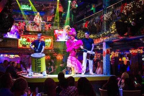 a group of people on stage in a nightclub at Rooftop Retreat on Ocean Drive with Beach View in Miami Beach