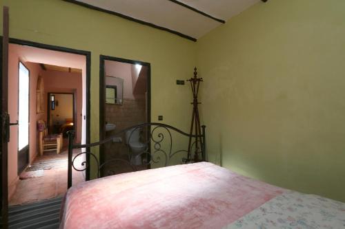 a bedroom with a bed in a room at Gite Ogog Tacheddirt in Tacheddirt