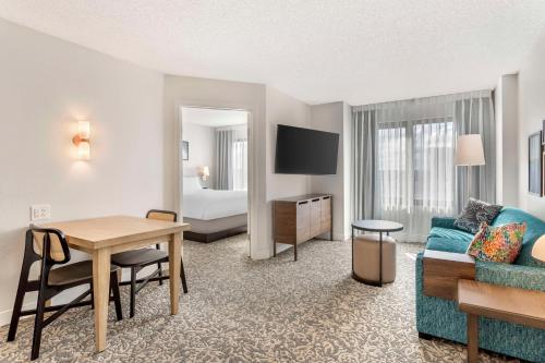 a living room with a couch and a table at Sonesta ES Suites San Antonio Downtown Alamo Plaza - Newly Renovated in San Antonio