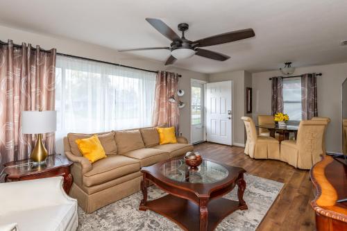 a living room with a couch and a table at Stylish & Cozy 2br Home Great Location & Comfort in Kettering
