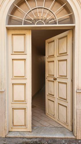 an entrance to a garage with two doors at Suite n 5 in Pompei