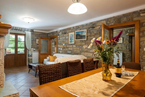 a living room with a table and a bedroom at Activity and familiy Villa Milena with heated pool in Kršan