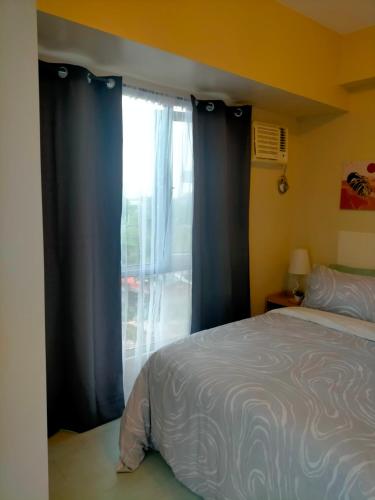 Llit o llits en una habitació de Sunset Suite