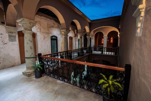 an empty hallway of a building with a balcony at Casa 1800 Oaxaca Boutique Hotel City Center based in Oaxaca City