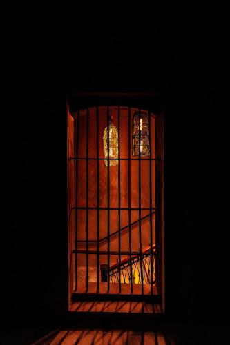 a door with a window in a dark room at Casa 1800 Oaxaca Boutique Hotel City Center based in Oaxaca City