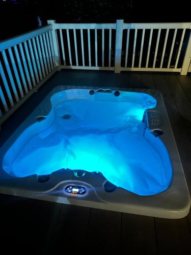 a jacuzzi tub in a backyard at night at Tattershall Lakes Mini Breaks - Fishing Lake Two in Lincoln