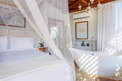 Postel nebo postele na pokoji v ubytování Gringos Boutique Hotel
