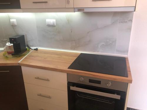a kitchen with a counter top and a counter top at Brand new renovated apartment by the stadium in Aridaia