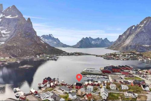 an aerial view of a town on a lake with mountains at Reine Front View - Mountain & Seaview in Reine