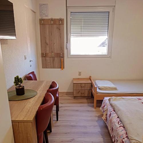 Postel nebo postele na pokoji v ubytování Prenoćište, sobe AN-KA