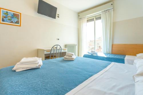 Postel nebo postele na pokoji v ubytování Hotel Selene - Vista Mare