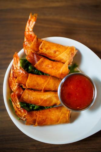 a plate of food with fries and sauce on a table at Flying Horse Resort & Club in Colorado Springs