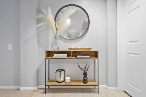a console table with a mirror in a room at Massive 7BR Stunning MTN View Zen Retreat Pool and Spa in Ramona