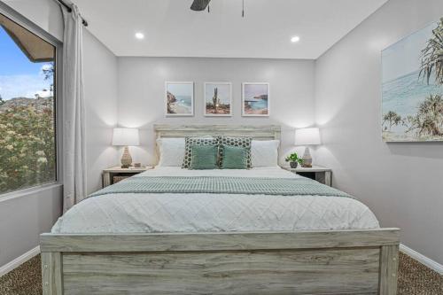 a bedroom with a large bed and a window at Massive 7BR Stunning MTN View Zen Retreat Pool and Spa in Ramona
