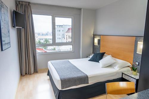 Postel nebo postele na pokoji v ubytování Hotel Faranda Pathos Gijón, Ascend Hotel Collection