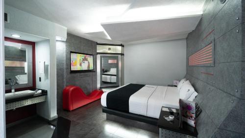 Ένα ή περισσότερα κρεβάτια σε δωμάτιο στο Kuboz Motor Hotel (Motel y Hotel)