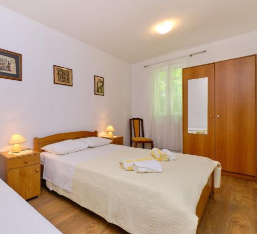 Posteľ alebo postele v izbe v ubytovaní Apartments Nada
