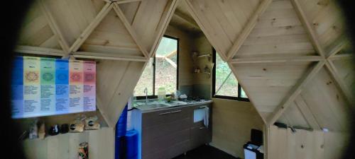 a small bathroom with a sink and a sink at Sanayá Domo Glamping - Santa Elena in Santa Elena